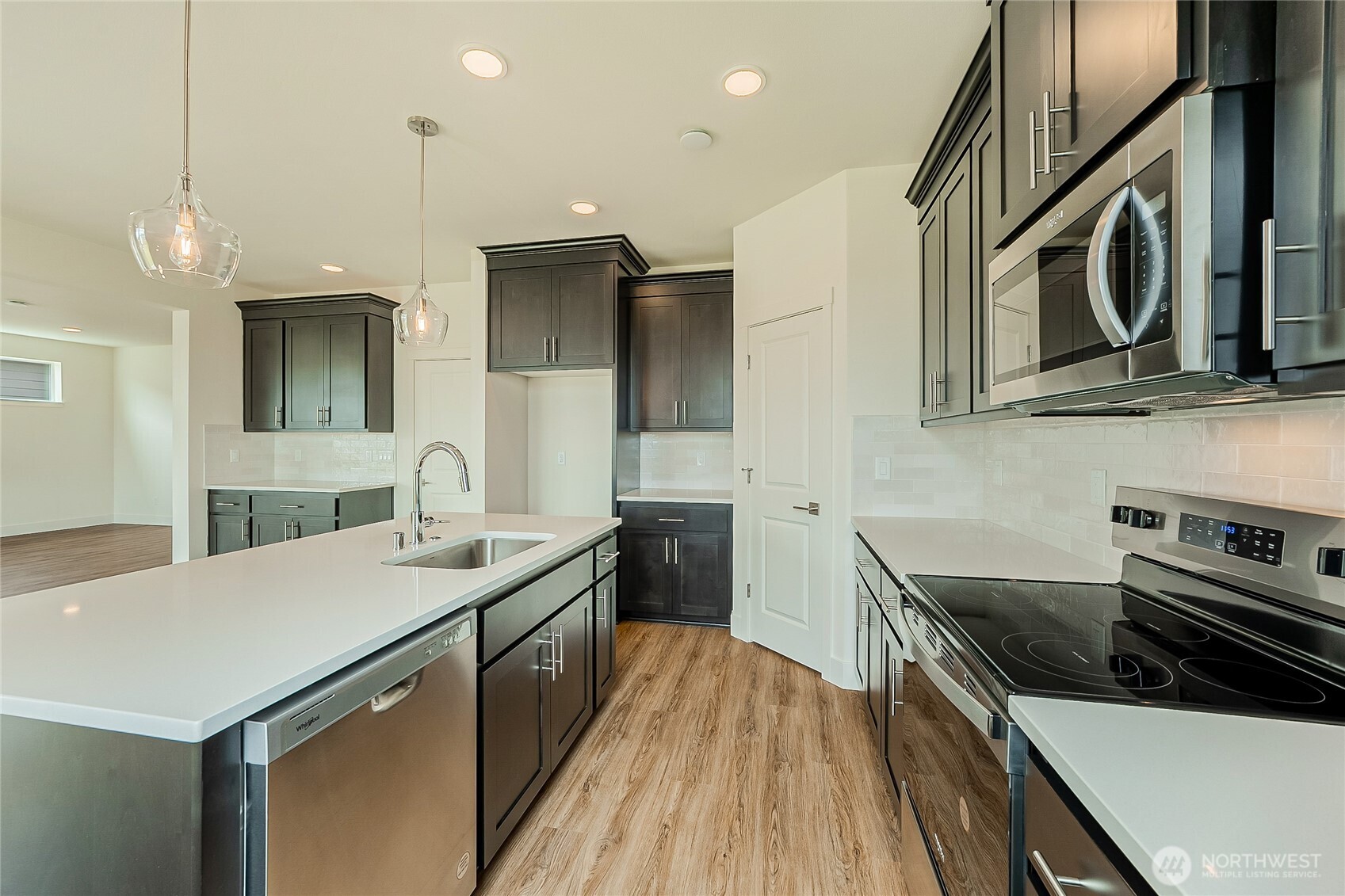 404 Pagget Avenue Winlock, WA 98596 - Photo 14 of 40 a kitchen with a sink stove and microwave
