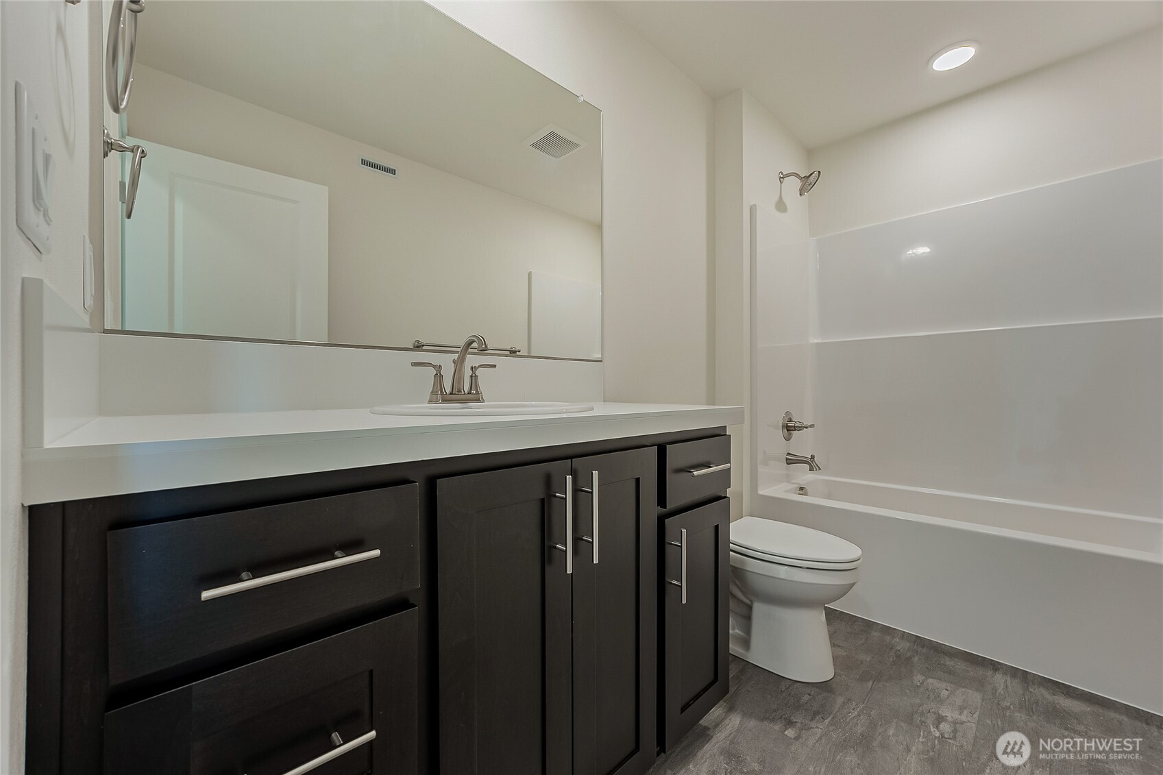 404 Pagget Avenue Winlock, WA 98596 - Photo 29 of 40 a bathroom with a sink a toilet a mirror and bathtub