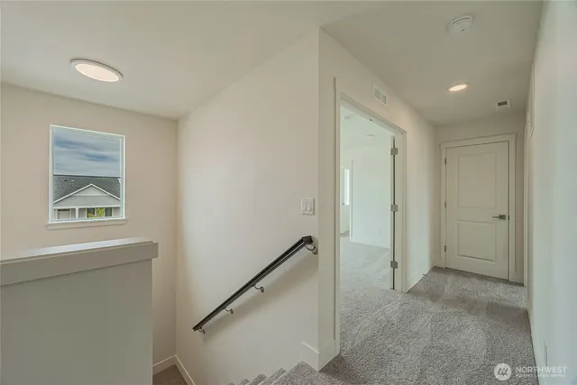 a view of hallway with window and hallway