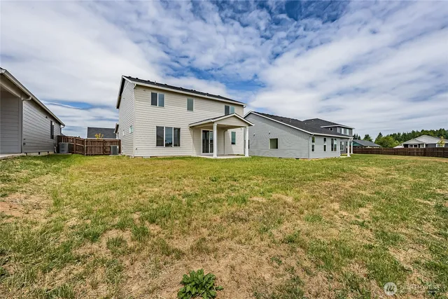 a house view with swimming pool in front of it