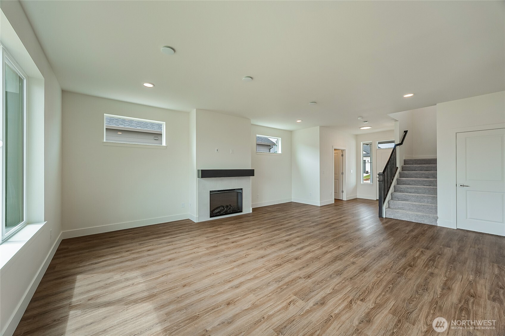 404 Pagget Avenue Winlock, WA 98596 - Photo 8 of 40 a view of empty room with wooden floor and fireplace