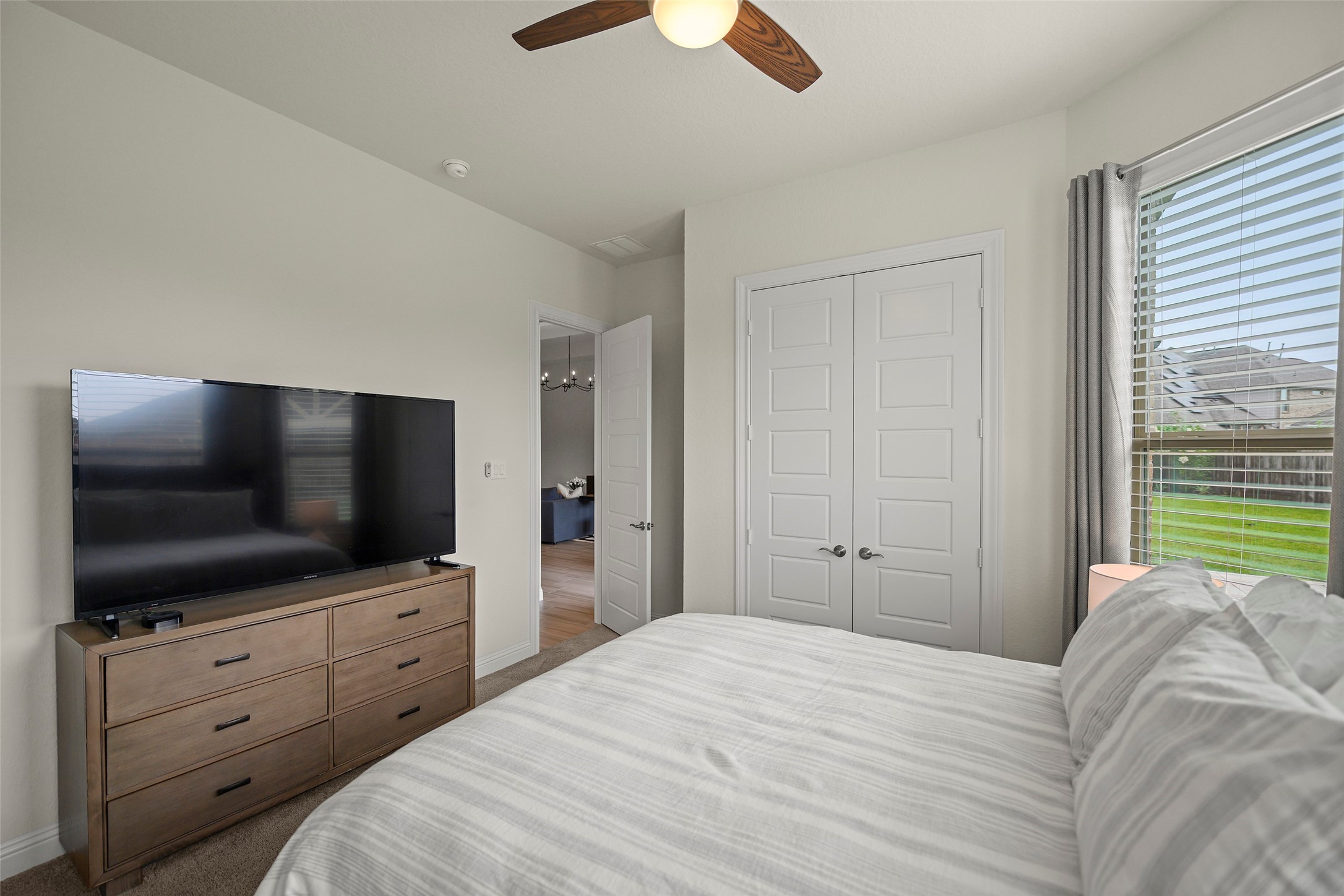 20330 Rosegold Way Spring, TX 77379 - Photo 22 of 48 Secondary bedroom includes generous closet space and a neutral color palette ready for your personal touch.