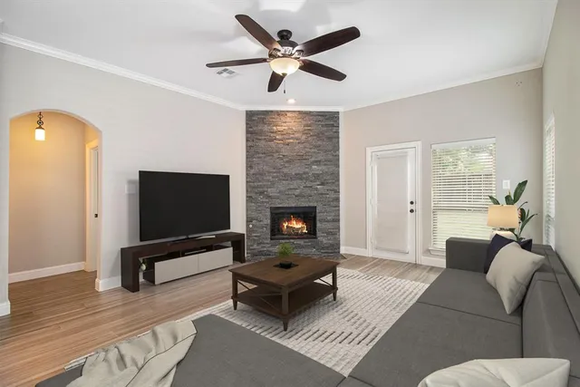 a living room with furniture and a flat screen tv