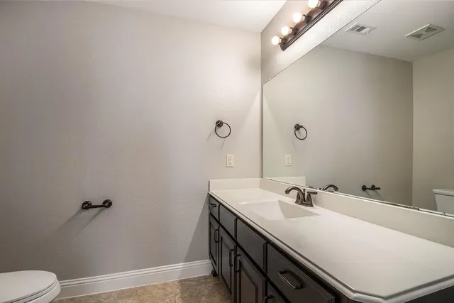 a bathroom with a bathtub and a toilet