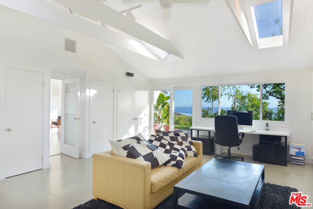 6249 Tapia Drive Malibu, CA 90265 - Photo 13 of 21 a living room with furniture and a large window