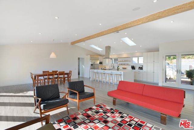 a living room with furniture and a table