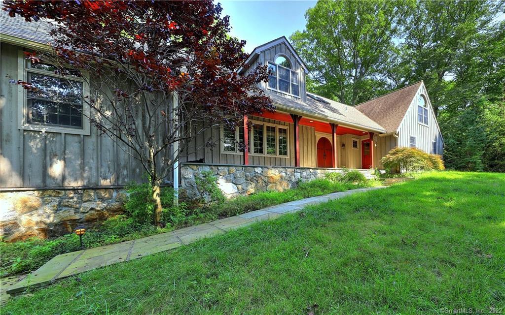 11 Partrick Lane Westport, CT 06880 - Photo 1 of 1 a front view of house with yard and green space