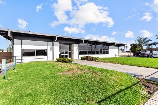 a view of a big house with a street