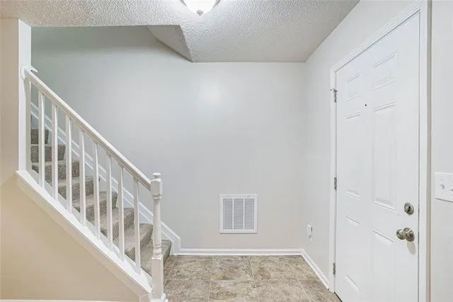 a view of an entryway with wooden floor