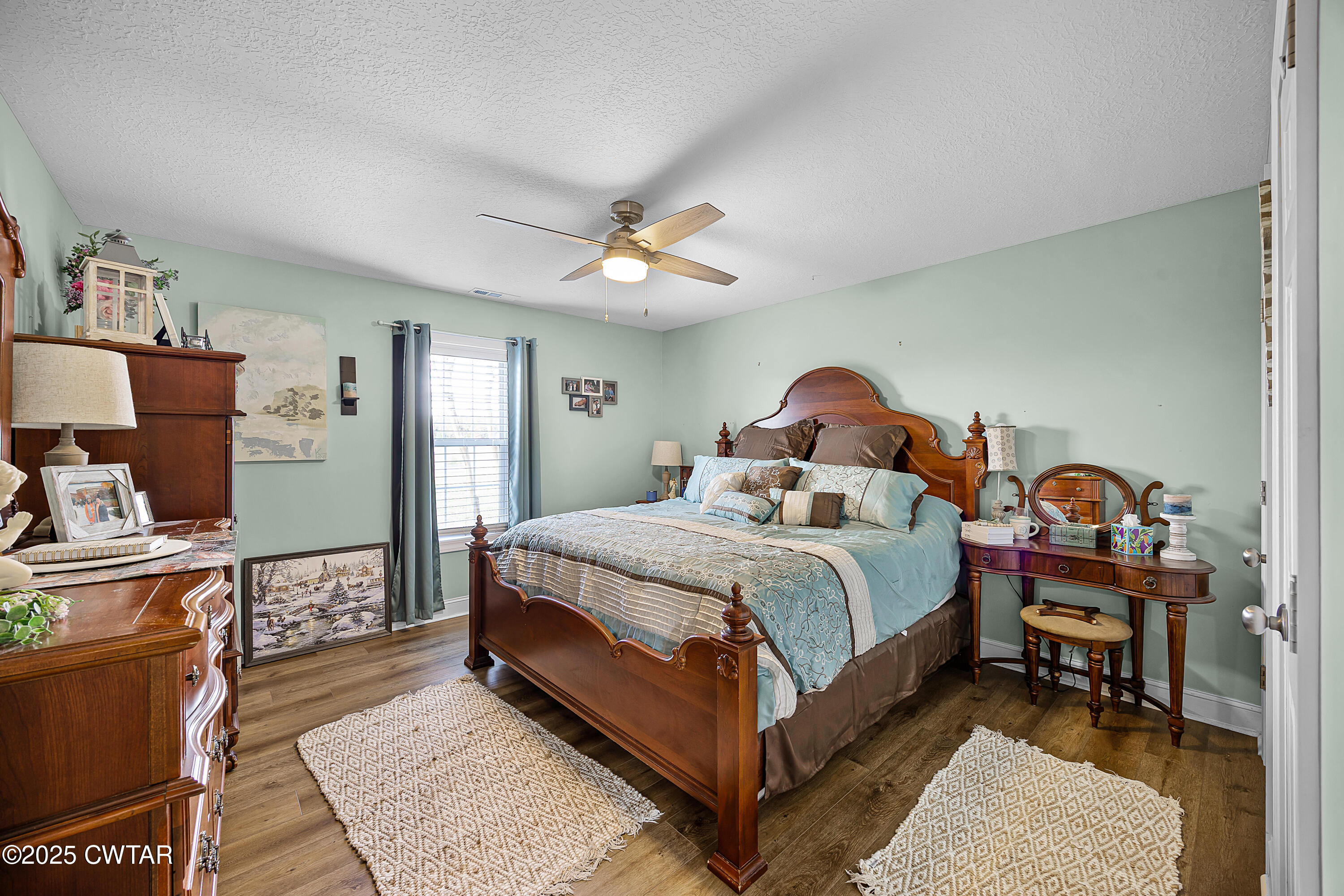 18232 Highway 79 Gadsden, TN 38337 - Photo 12 of 22 a bedroom with a bed and a chandelier