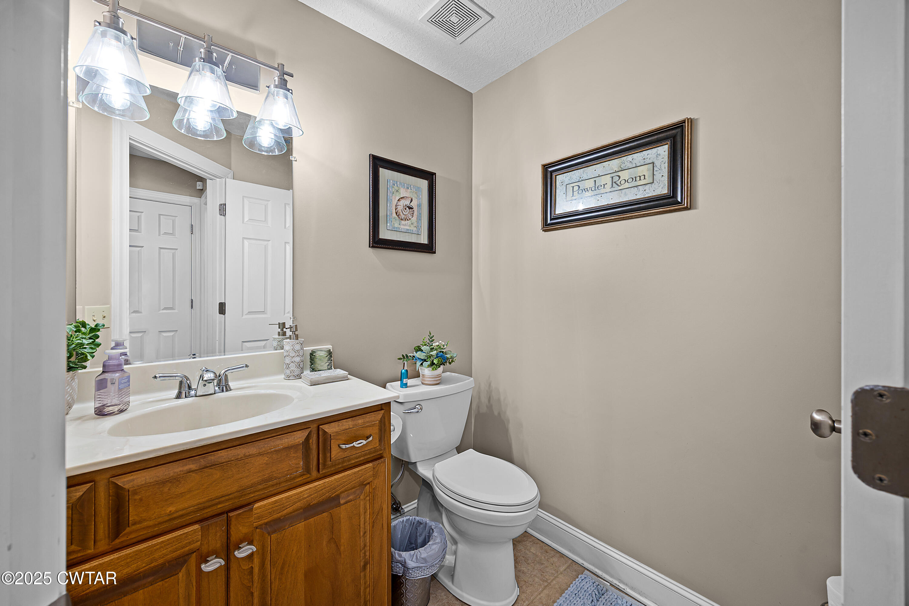 18232 Highway 79 Gadsden, TN 38337 - Photo 13 of 22 a bathroom with a toilet a sink and mirror