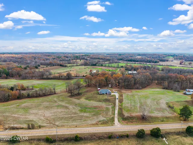 a view of a lake with houses in the back