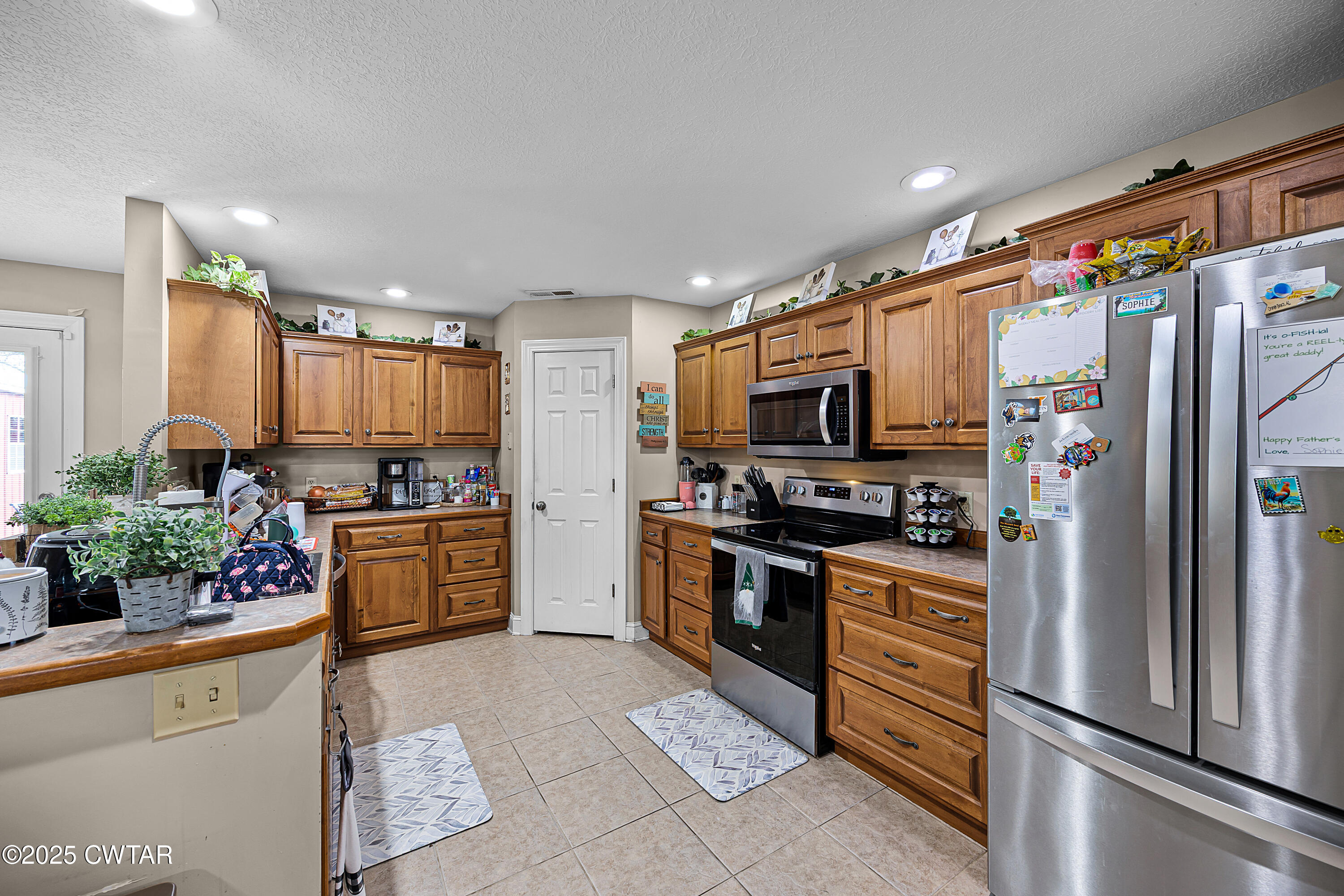 18232 Highway 79 Gadsden, TN 38337 - Photo 6 of 22 a kitchen with stainless steel appliances granite countertop a refrigerator and a stove top oven
