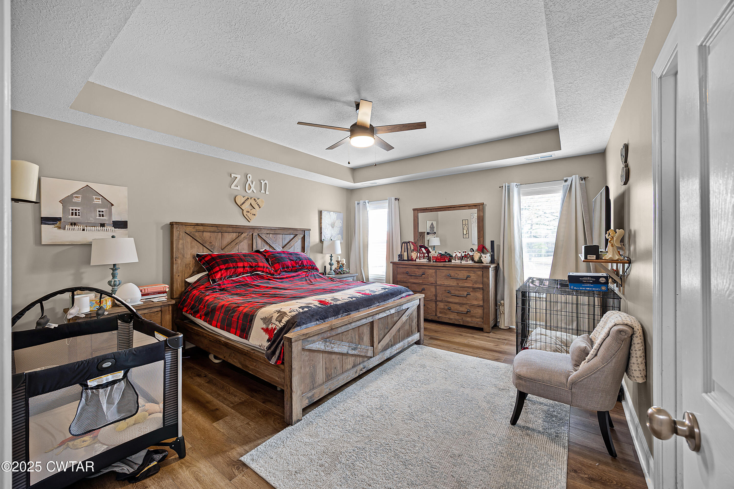 18232 Highway 79 Gadsden, TN 38337 - Photo 8 of 22 a bedroom with a bed a couch and a chandelier