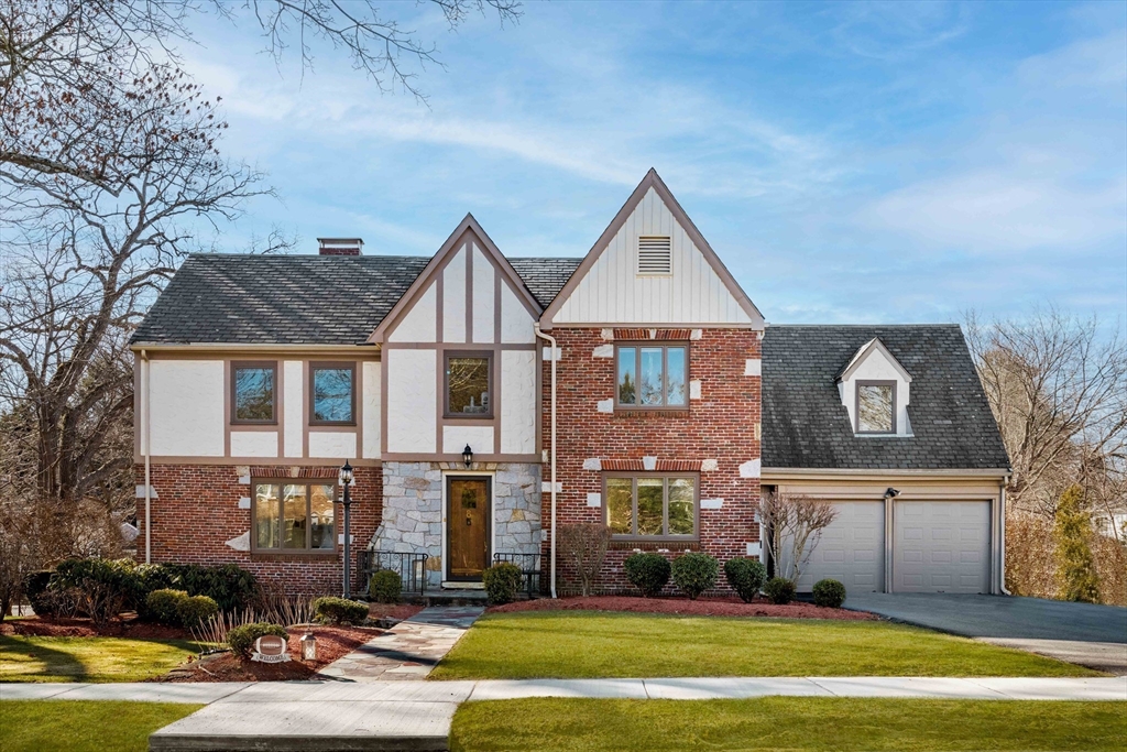 a front view of a house with swimming pool and porch