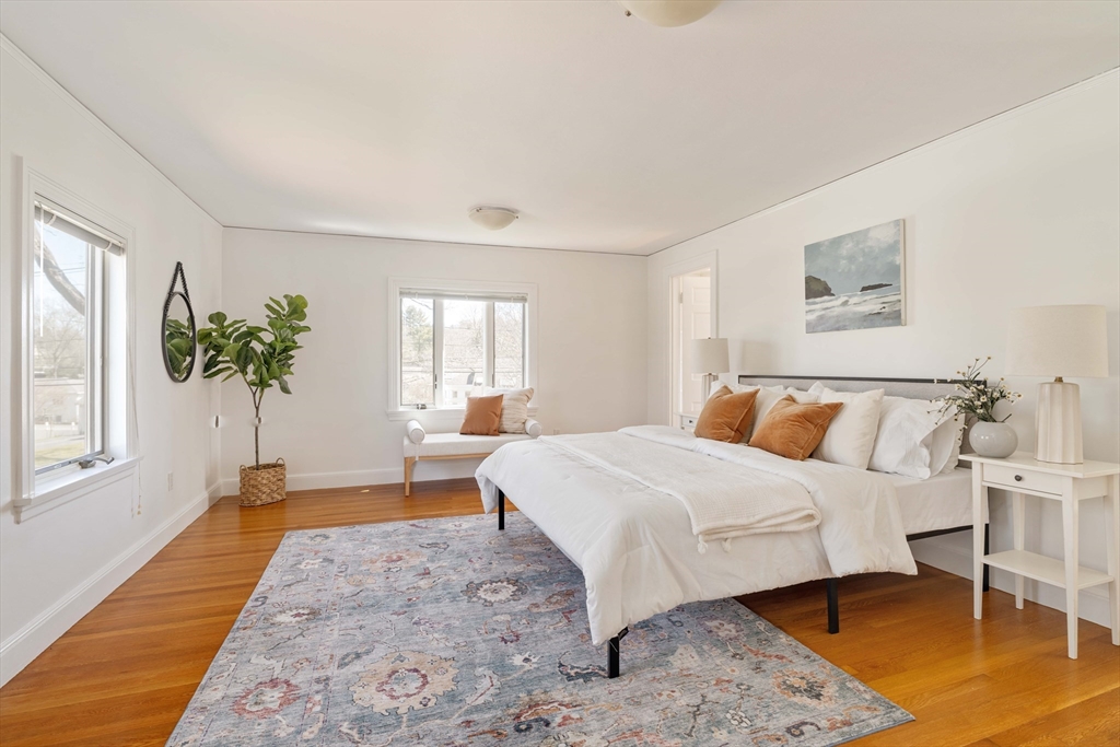 8 Littlefield Road Newton, MA 02459 - Photo 12 of 33 a bedroom with a large bed and a window