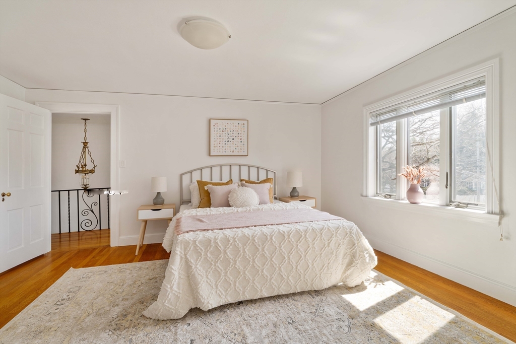 8 Littlefield Road Newton, MA 02459 - Photo 17 of 33 a bedroom with a bed and wooden floor