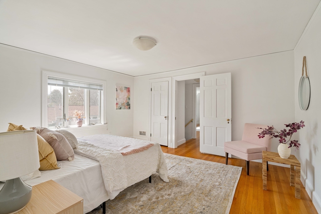 8 Littlefield Road Newton, MA 02459 - Photo 18 of 33 a spacious bedroom with a bed and a couch