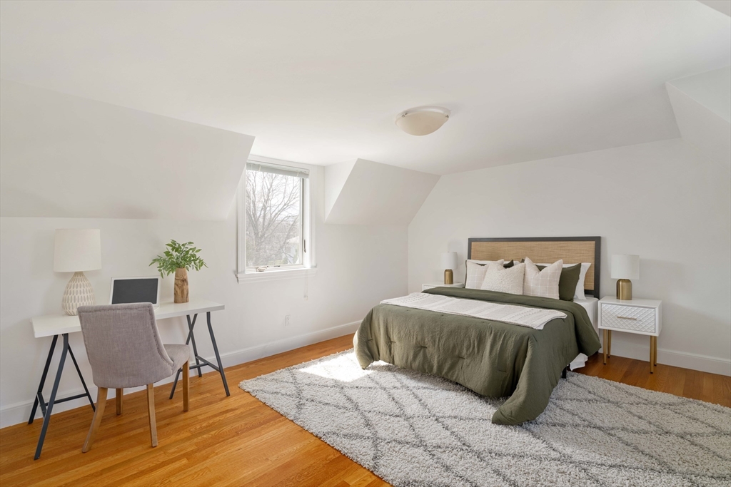 8 Littlefield Road Newton, MA 02459 - Photo 21 of 33 a bedroom with a bed and a chair