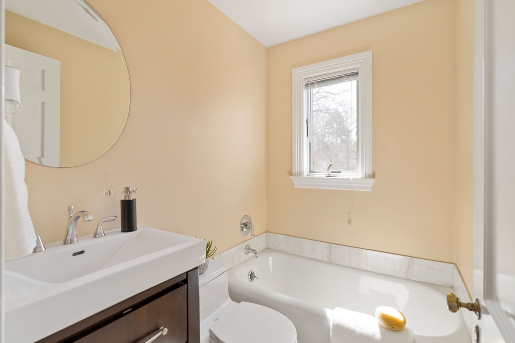 8 Littlefield Road Newton, MA 02459 - Photo 29 of 33 a bathroom with a sink and a mirror