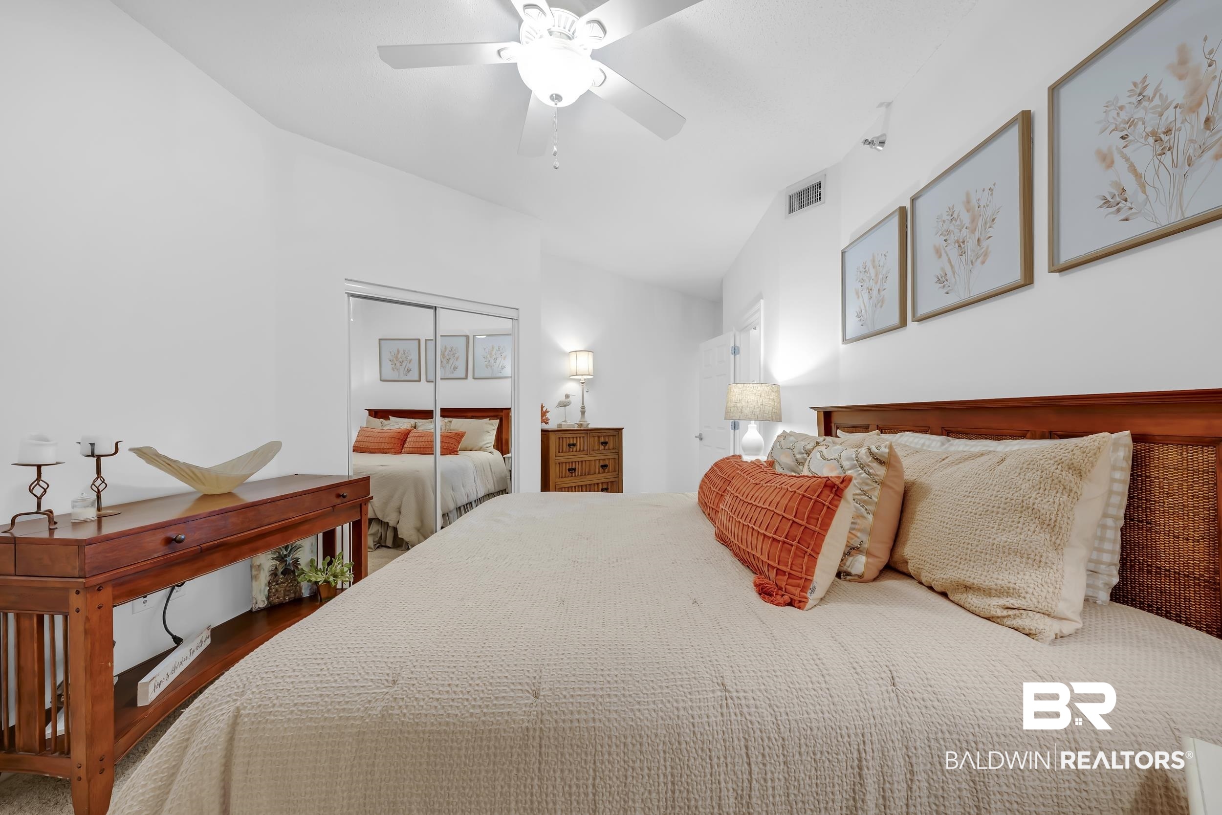 27282 Canal Road, Unit 104 Orange Beach, AL 36561 - Photo 49 of 79 Bedroom featuring a closet and a ceiling fan