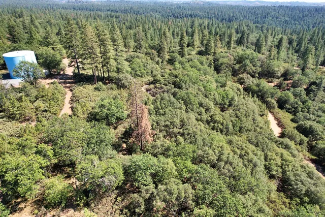 a view of a mountain with an outdoor space and mountain view