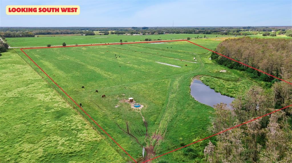 1099 South Canoe Creek Road Kenansville, FL 34739 - Photo 6 of 41 a view of a field with an outdoor space