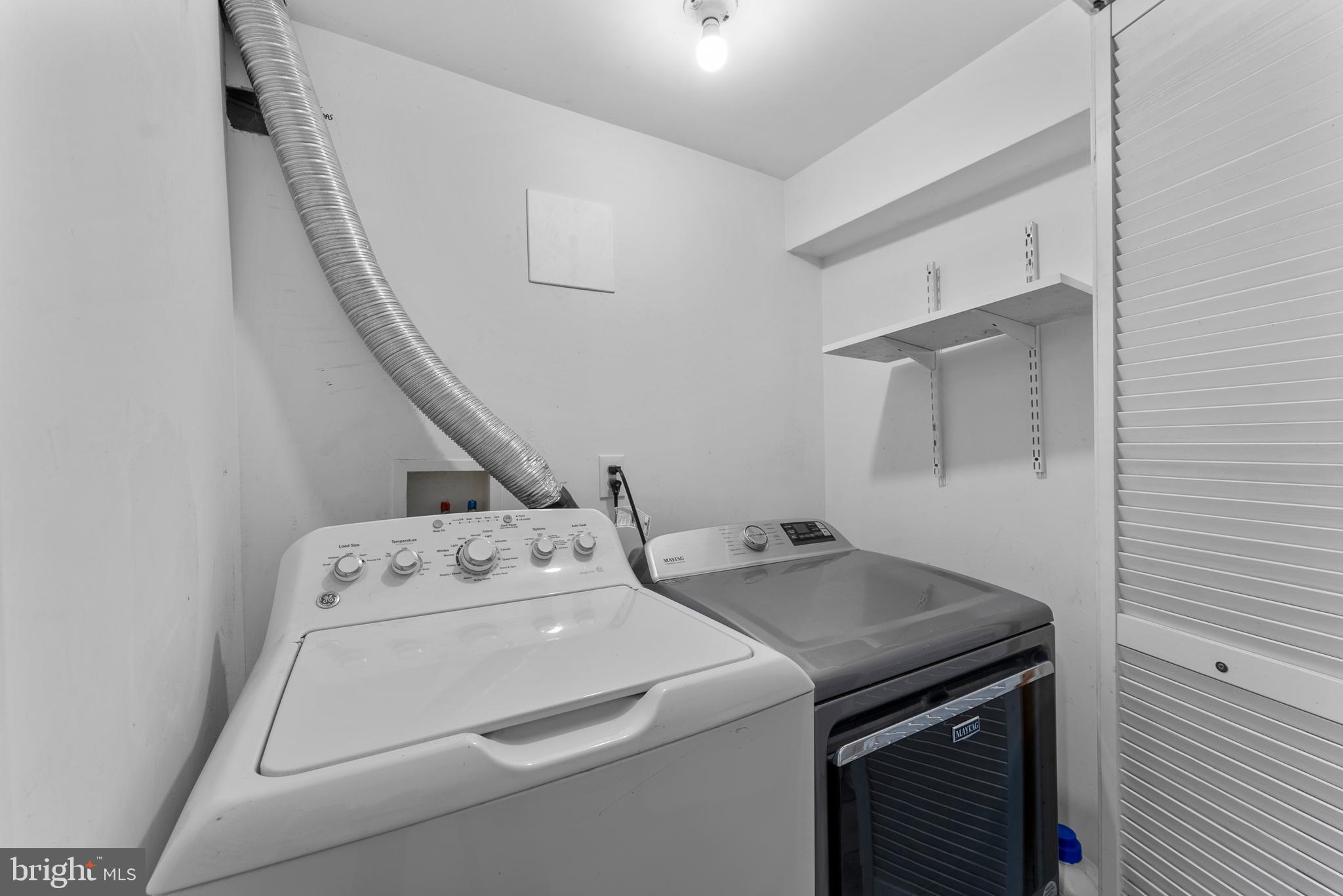 633 Walker Avenue Baltimore, MD 21212 - Photo 13 of 32 a utility room with dryer and washer