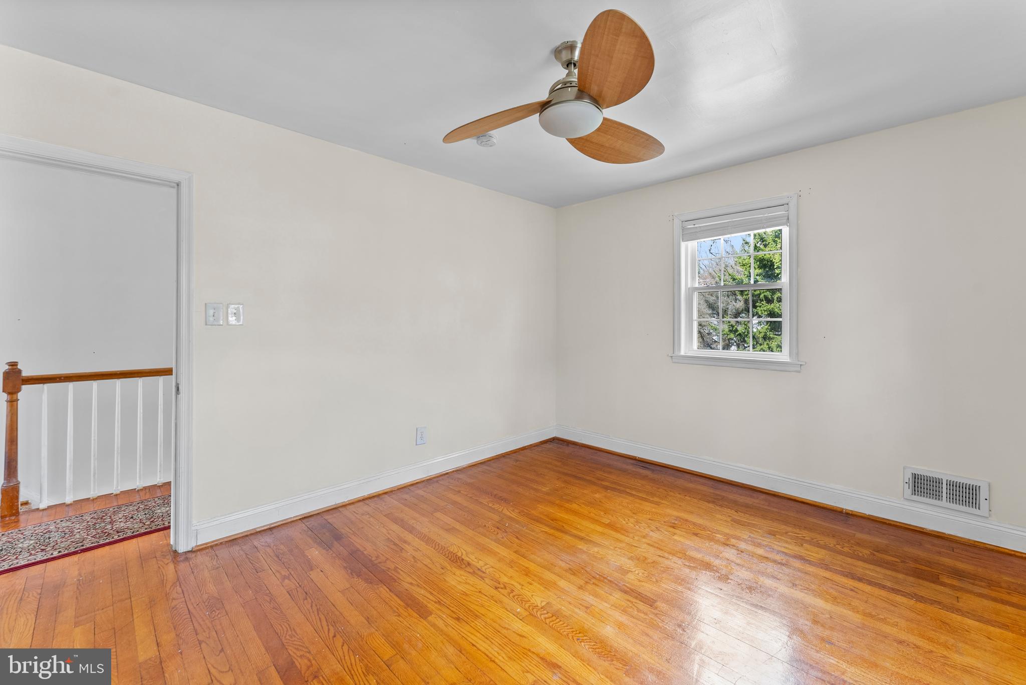 633 Walker Avenue Baltimore, MD 21212 - Photo 14 of 32 a view of empty room with wooden floor