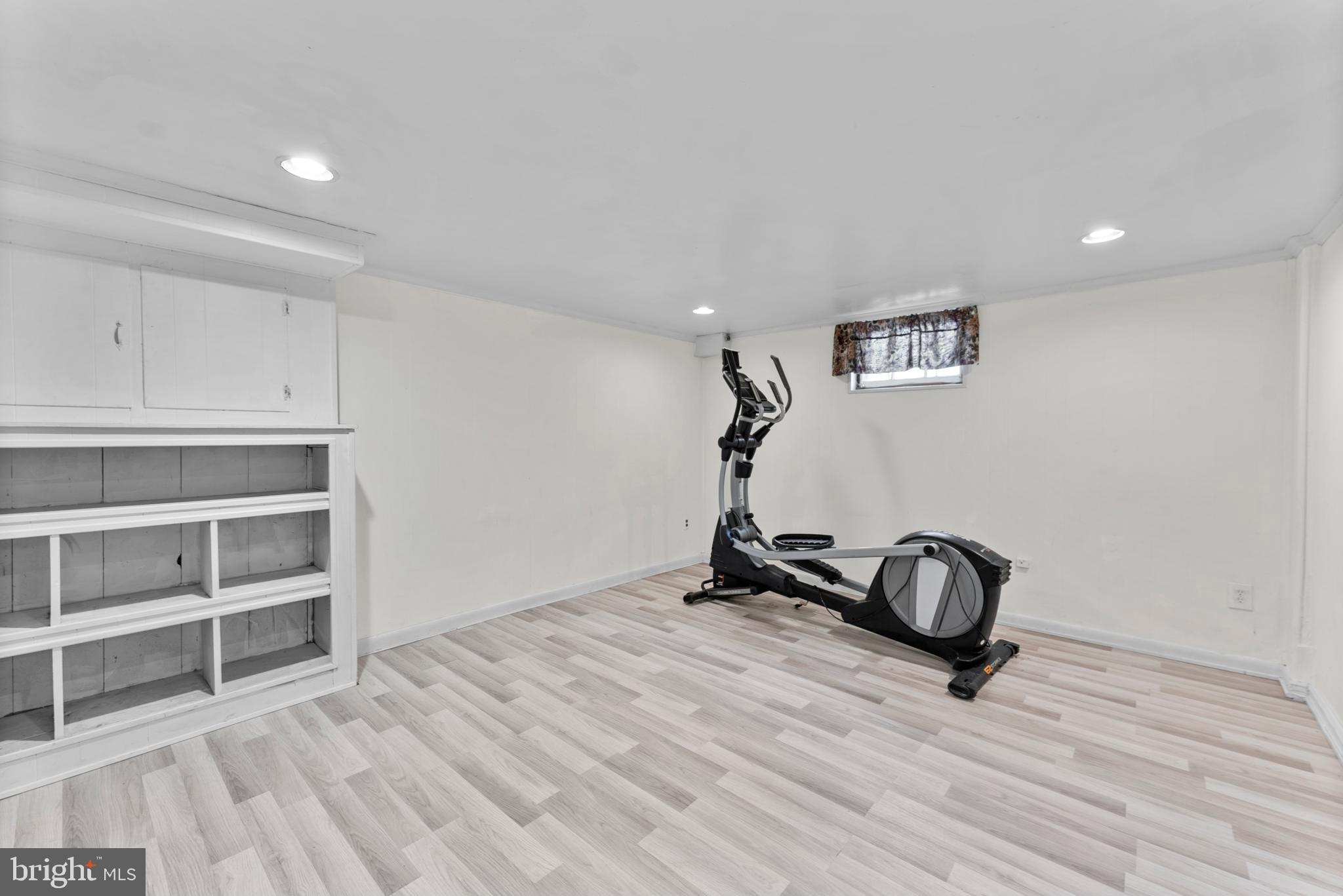 633 Walker Avenue Baltimore, MD 21212 - Photo 29 of 32 a view of a livingroom with hardwood floor and a window