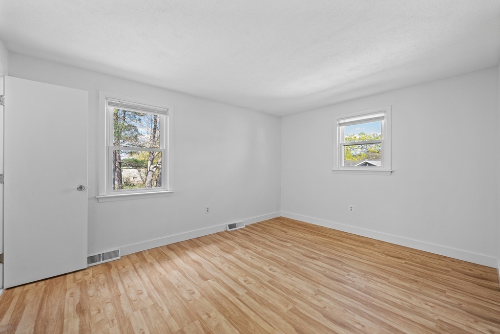 3 Lark Drive Hudson, MA 01749 - Photo 19 of 38 a view of empty room with wooden floor and fan