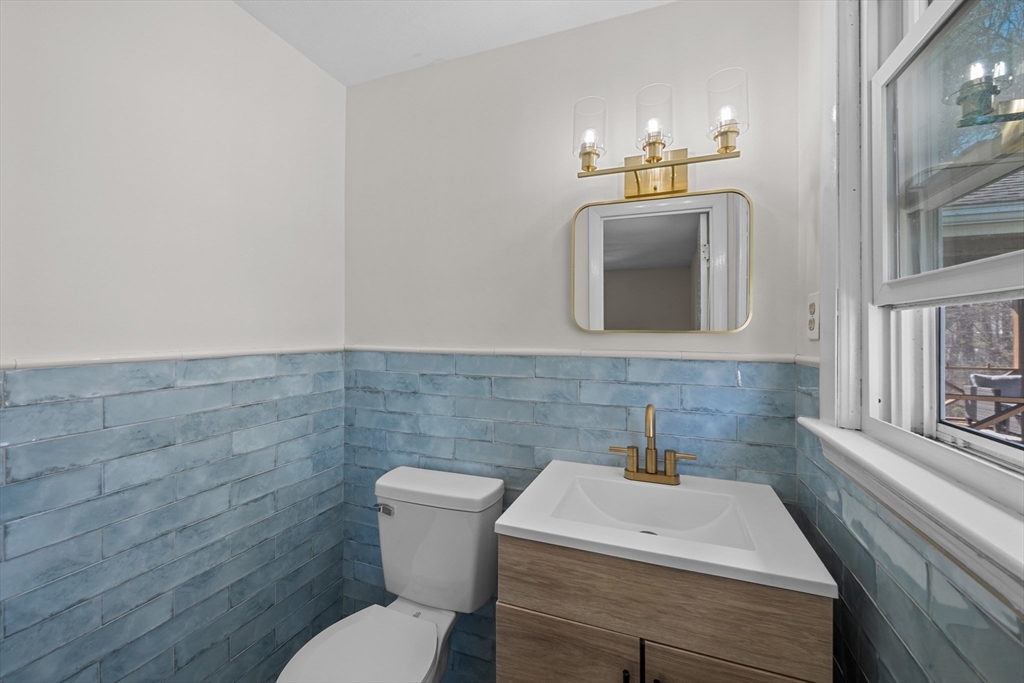 3 Lark Drive Hudson, MA 01749 - Photo 21 of 38 a bathroom with a toilet sink and mirror