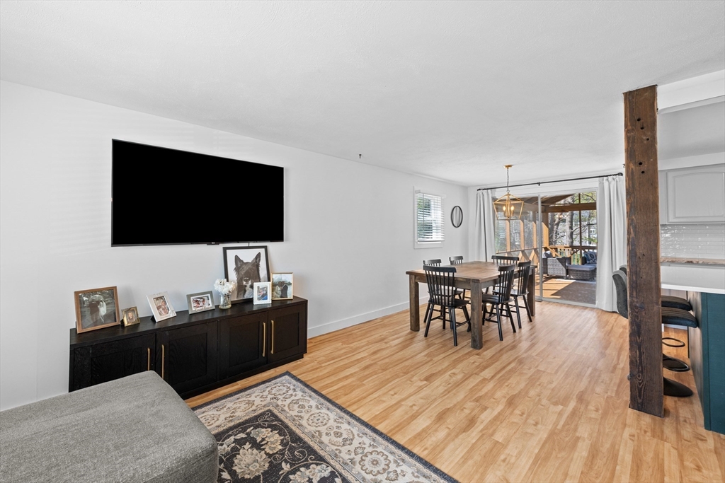 3 Lark Drive Hudson, MA 01749 - Photo 6 of 38 a living room with furniture and a flat screen tv