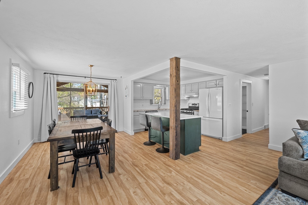 3 Lark Drive Hudson, MA 01749 - Photo 7 of 38 a view of a dining room with furniture window and wooden floor