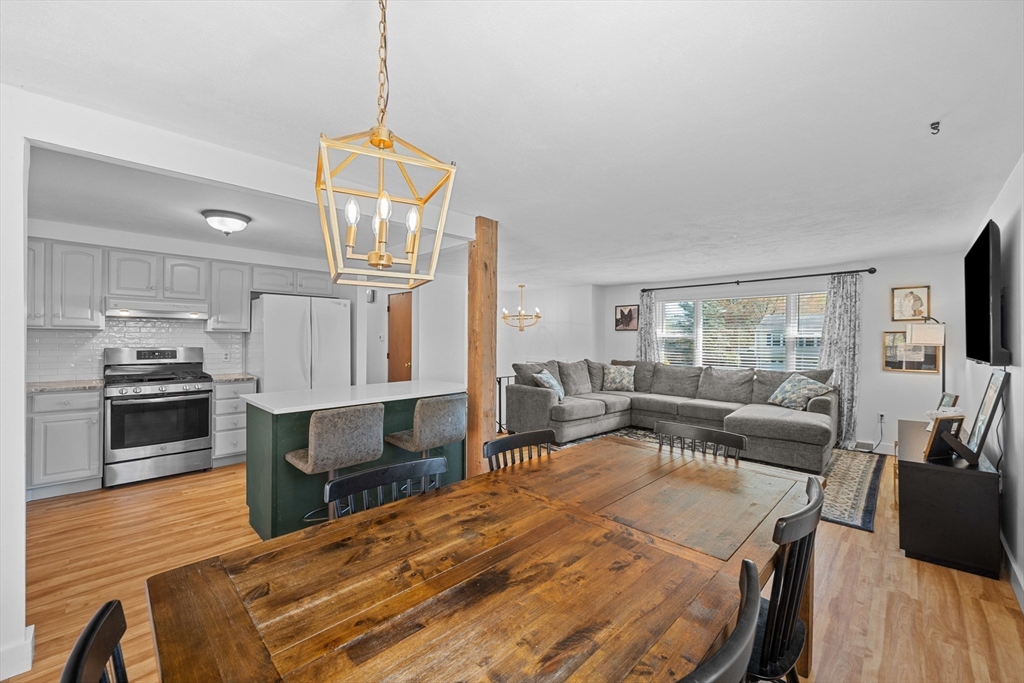 3 Lark Drive Hudson, MA 01749 - Photo 8 of 38 a large bedroom with a bed and a view of kitchen