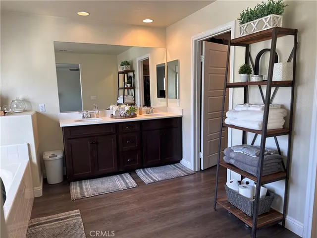 a view of a livingroom with furniture and hardwood floor