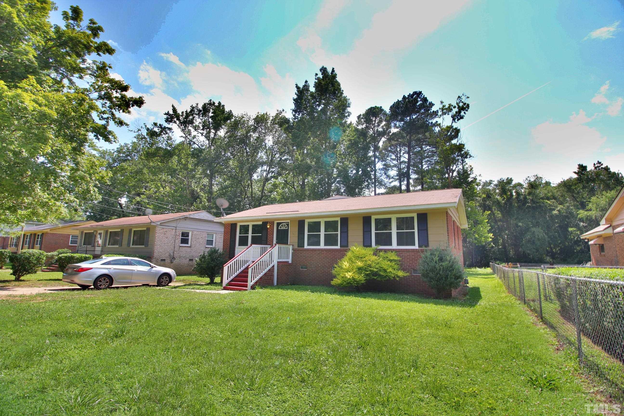 548 Dacian Road Raleigh, NC 27610 - Photo 1 of 16 a front view of a house with garden