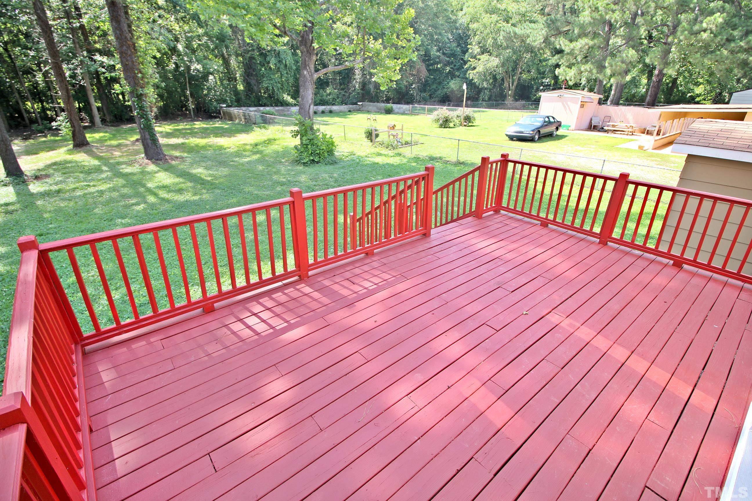 548 Dacian Road Raleigh, NC 27610 - Photo 14 of 16 a view of a wooden deck with a yard