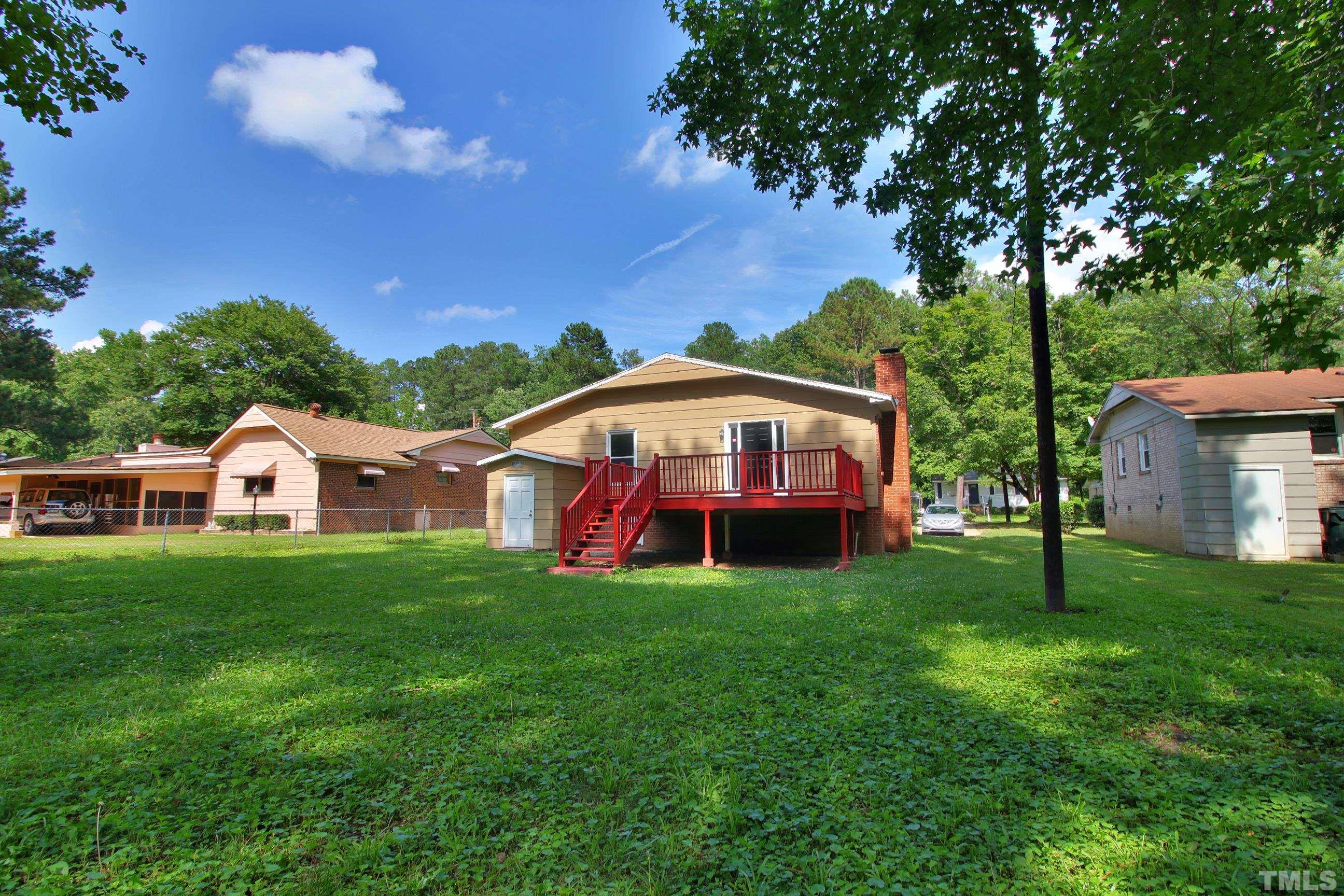548 Dacian Road Raleigh, NC 27610 - Photo 16 of 16 a view of a yard with a house in the background