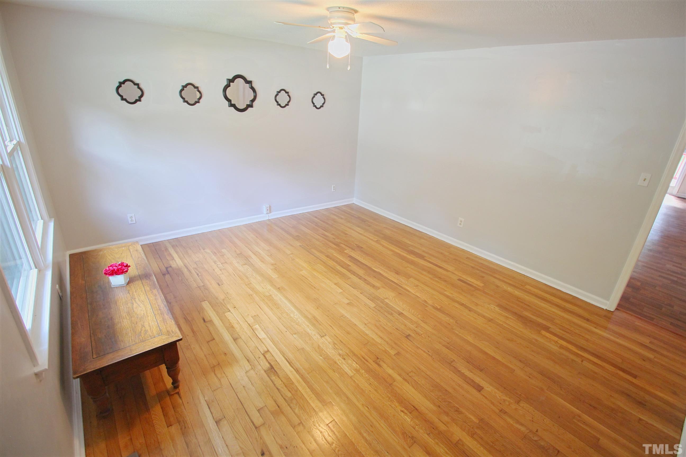 548 Dacian Road Raleigh, NC 27610 - Photo 2 of 16 a view of a room with wooden floor