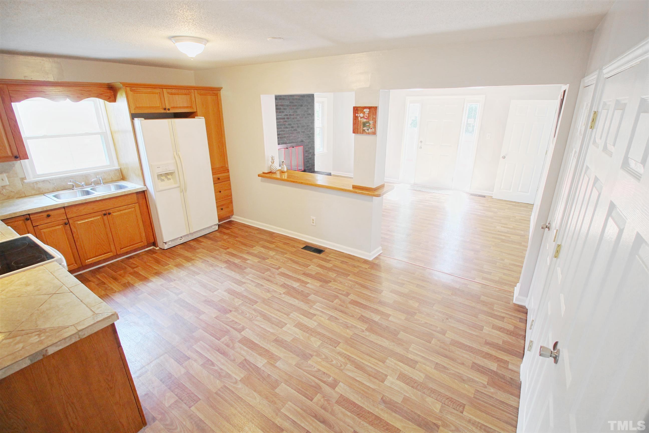 548 Dacian Road Raleigh, NC 27610 - Photo 8 of 16 a view of a room with wooden floor and a window