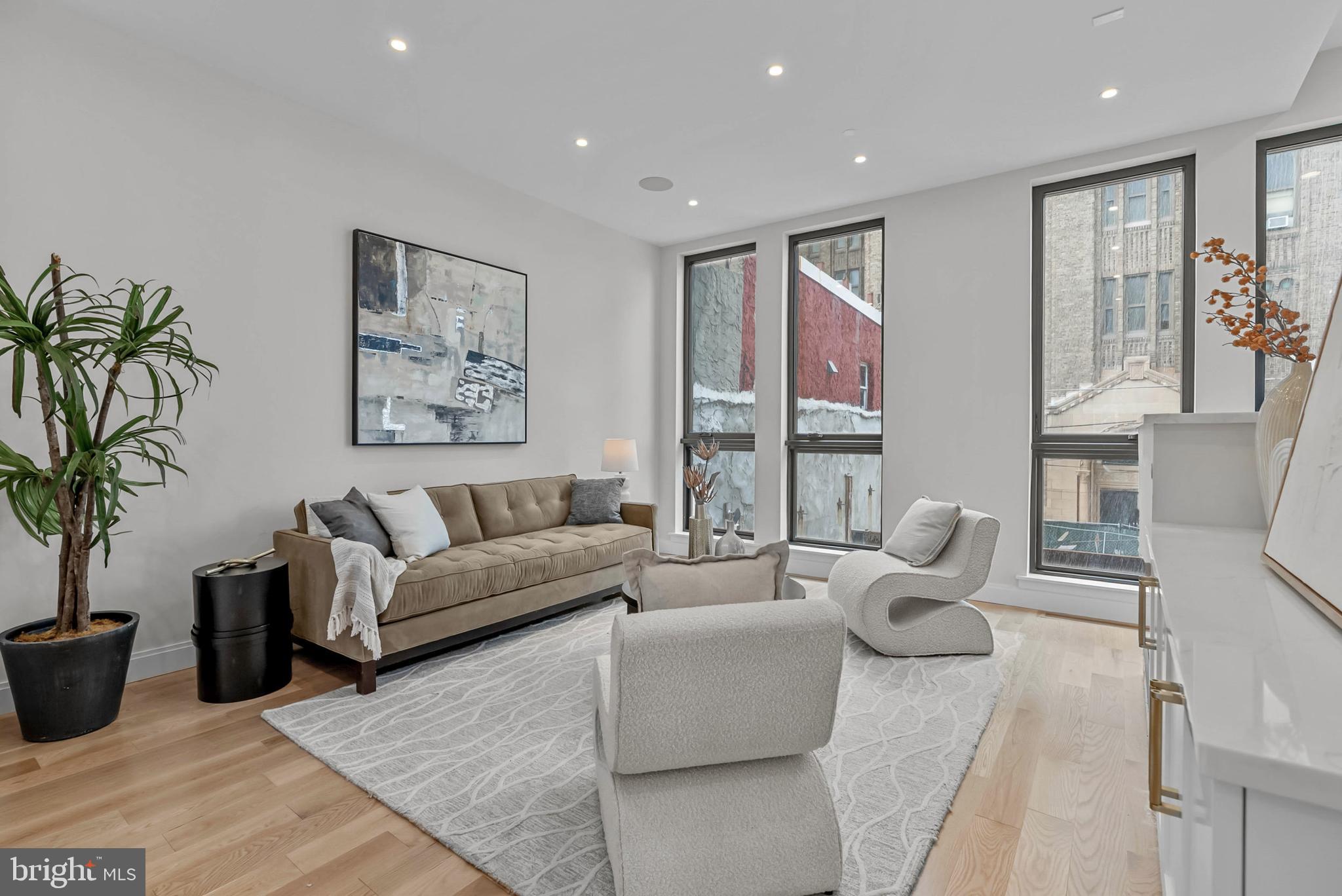 1100 Webster Street, Unit 4 Philadelphia, PA 19147 - Photo 14 of 53 a living room with furniture and a large window