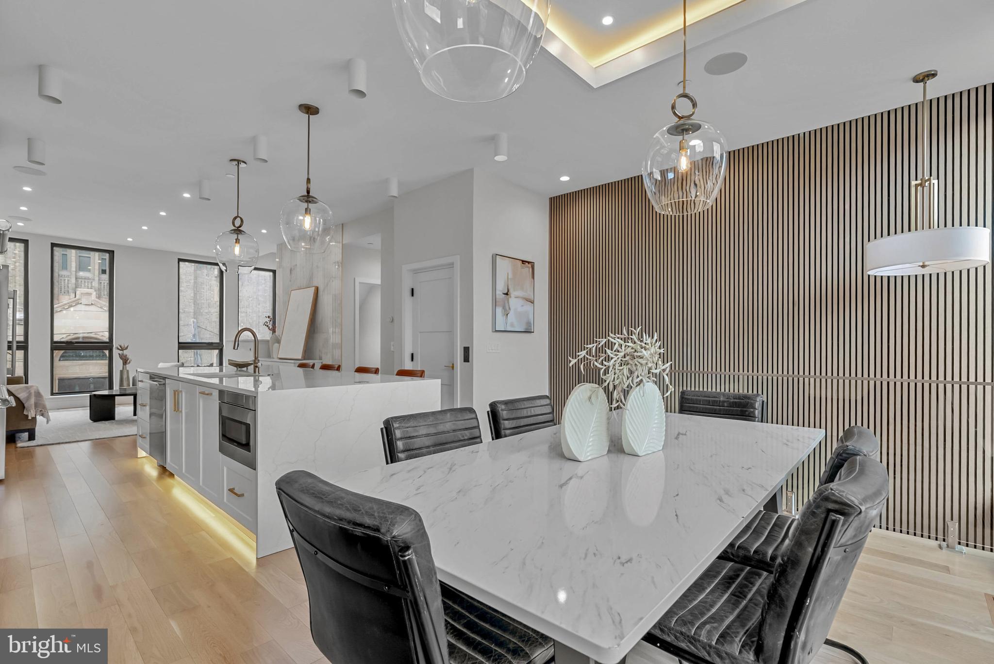 1100 Webster Street, Unit 4 Philadelphia, PA 19147 - Photo 19 of 53 a kitchen with a dining table chairs and stove