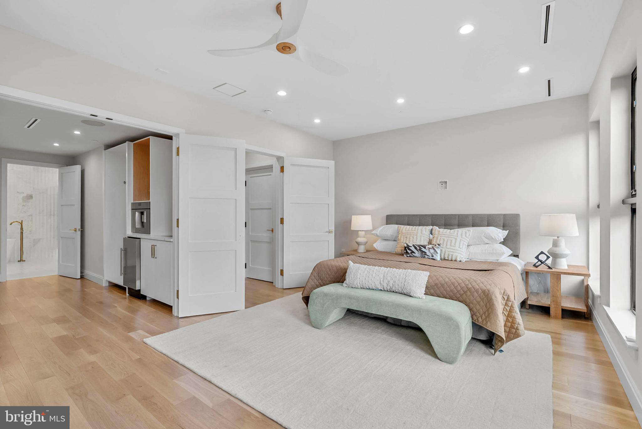 1100 Webster Street, Unit 4 Philadelphia, PA 19147 - Photo 26 of 53 a spacious bedroom with a bed and a refrigerator