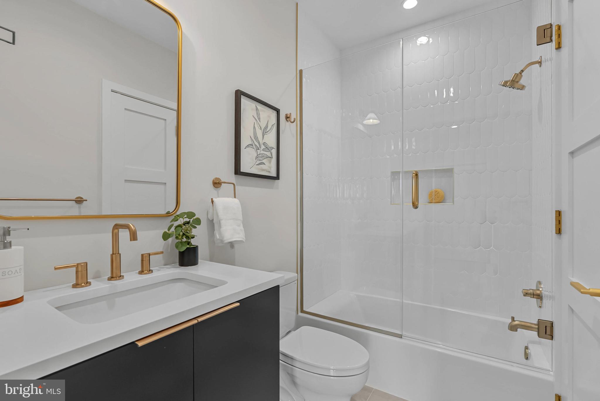 1100 Webster Street, Unit 4 Philadelphia, PA 19147 - Photo 41 of 53 a bathroom with a sink a toilet and shower