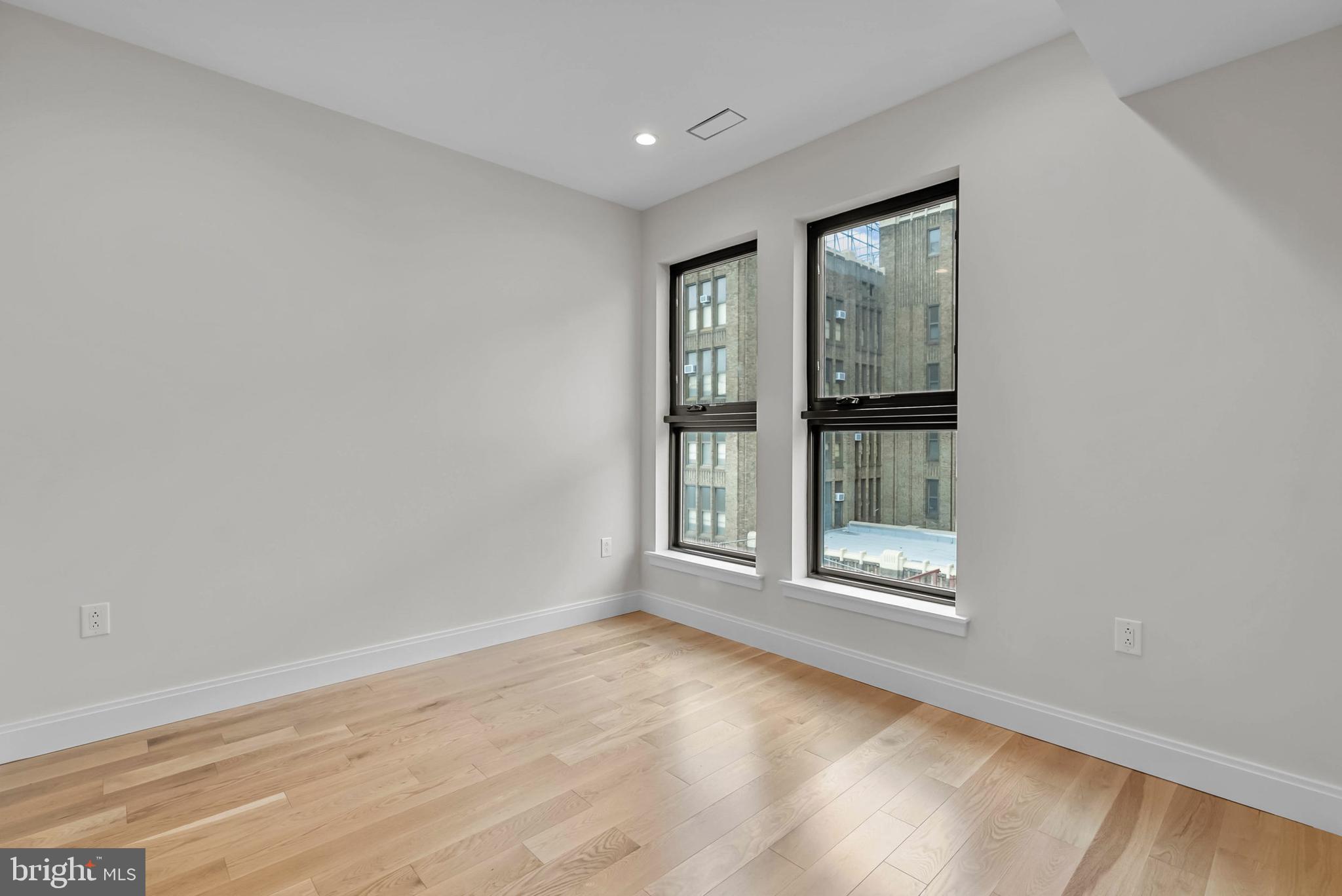 1100 Webster Street, Unit 4 Philadelphia, PA 19147 - Photo 42 of 53 wooden floor in an empty room with a window