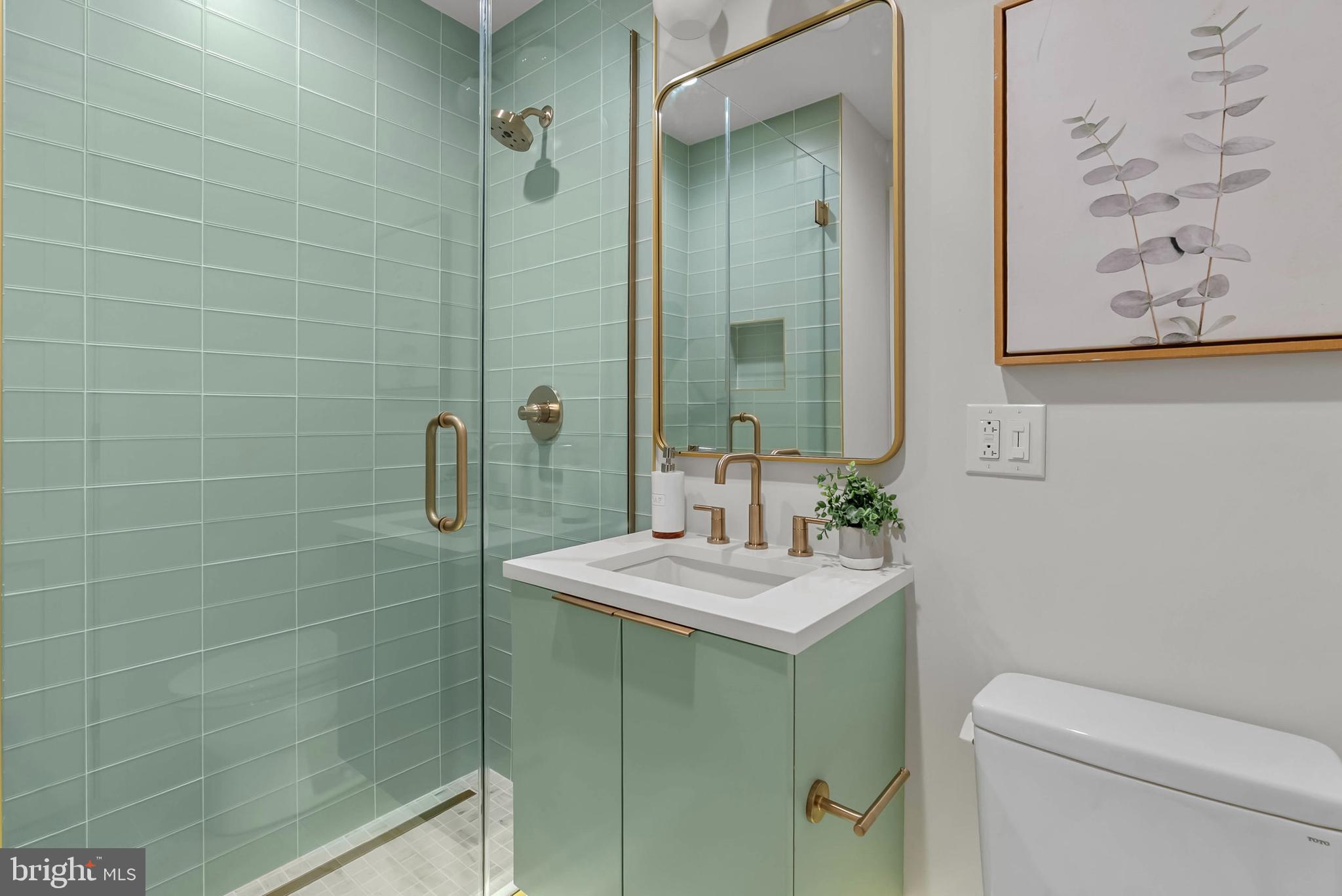 1100 Webster Street, Unit 4 Philadelphia, PA 19147 - Photo 44 of 53 a bathroom with a sink a toilet and shower