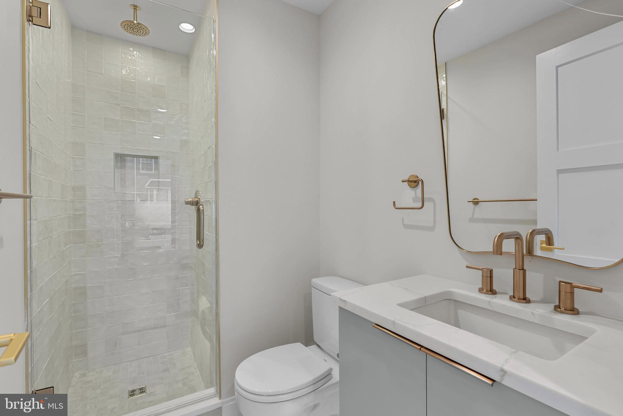 1100 Webster Street, Unit 4 Philadelphia, PA 19147 - Photo 47 of 53 a bathroom with a sink a toilet and shower