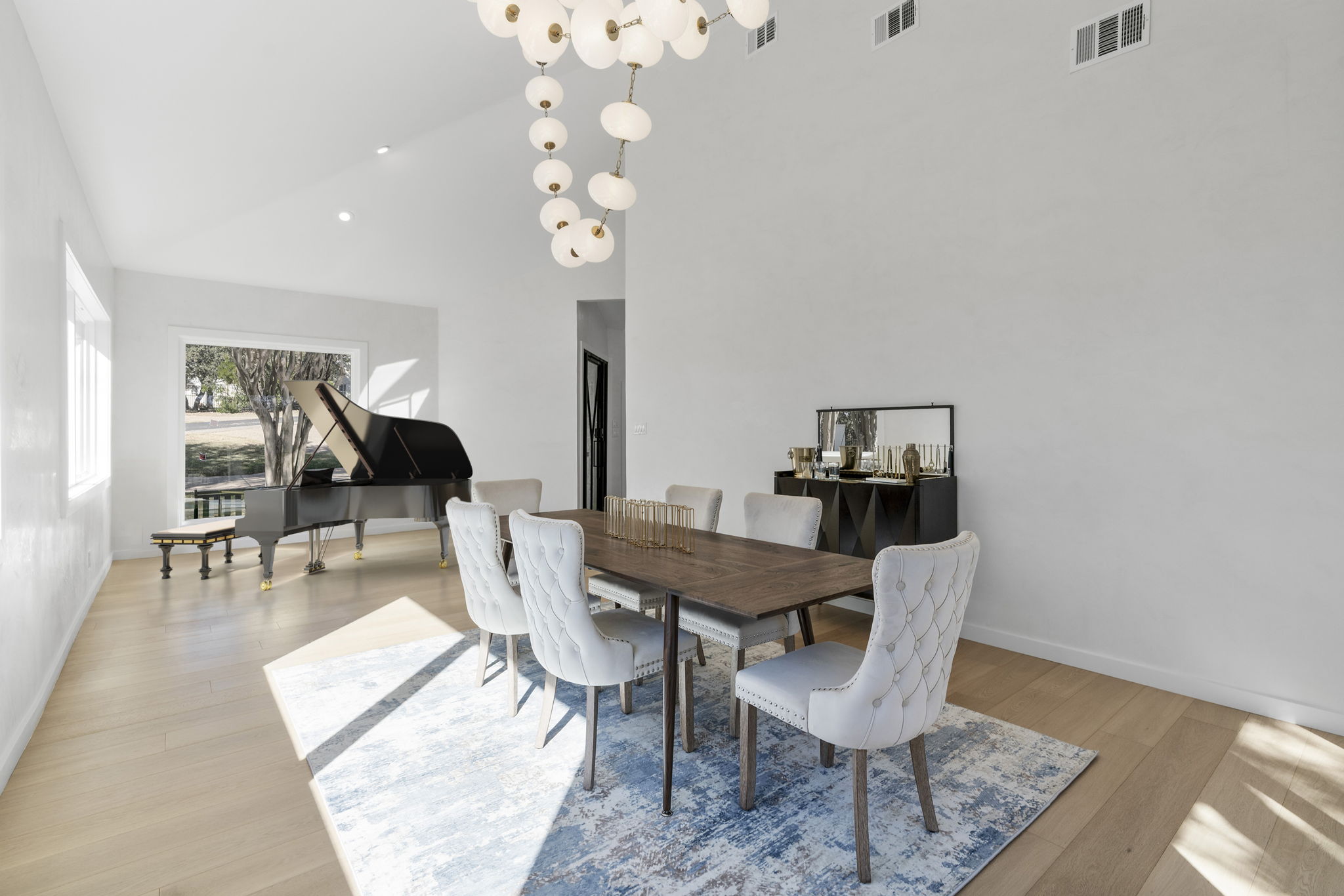 701 Furlong Drive Austin, TX 78746 - Photo 13 of 40 a view of a dining room with furniture and wooden floor