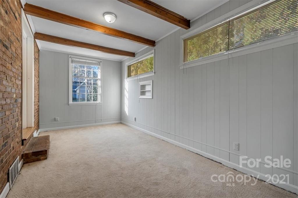 4919 Seacroft Road Charlotte, NC 28210 - Photo 12 of 25 an empty room with windows